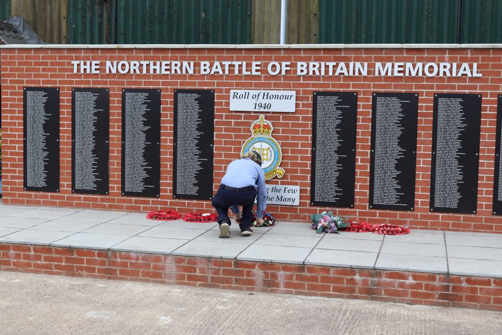 May be an image of 1 person and text that says "Roll of RollofHonour H Honour 1940 THE NORTHERN BATTLE OF BRITAIN MEMORIAL HHHHHHHH HHHHHHHHT Tbl بدظناننتتن the Few he Many"