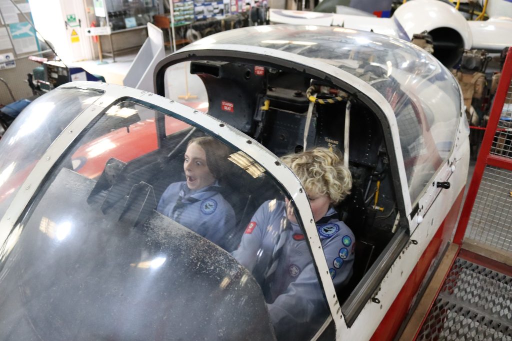 May be an image of 3 people, helicopter and text
