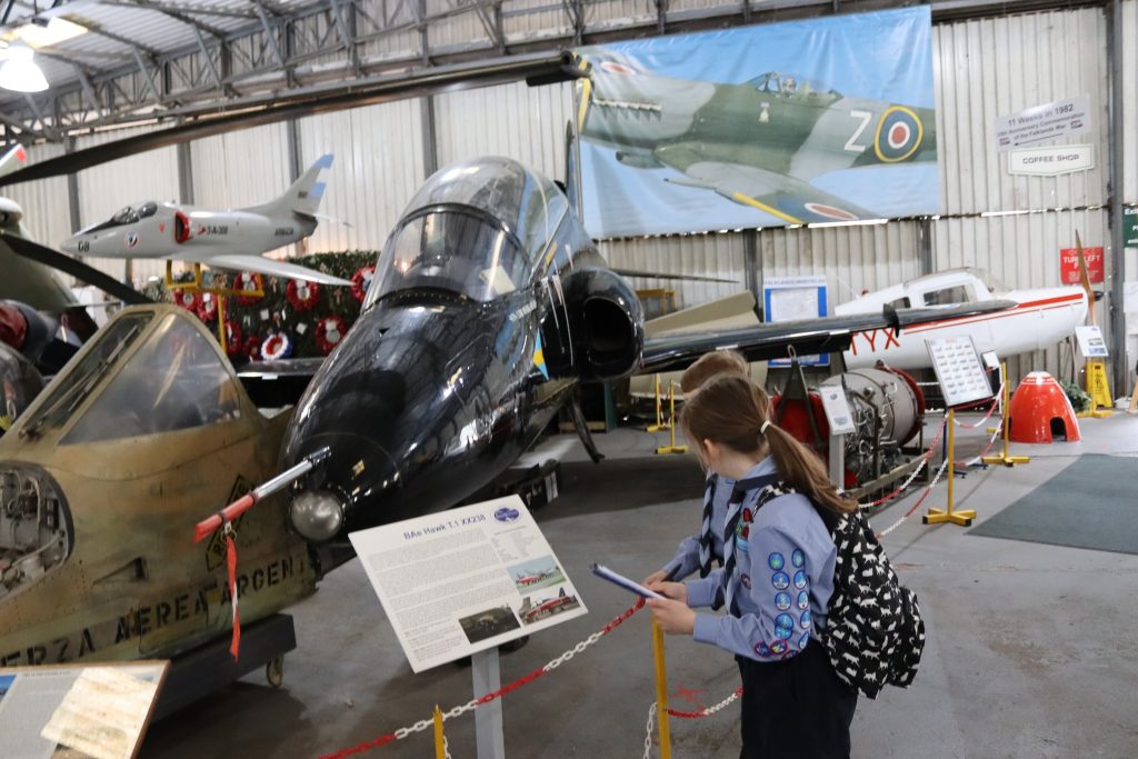 May be an image of 1 person, aircraft and text